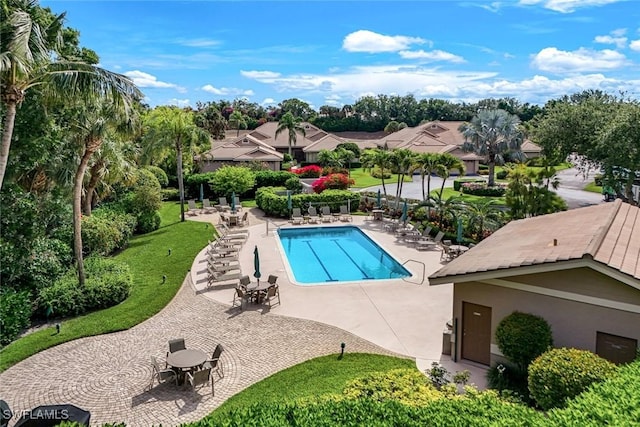 26271 Devonshire Ct Unit 202, Bonita Springs, FL 34134 - community pool featuring a patio area