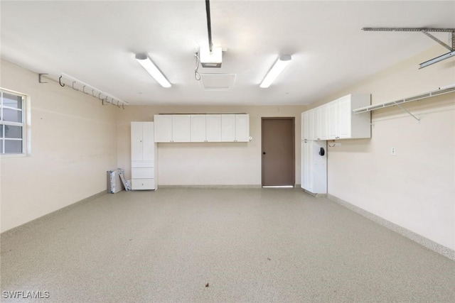 26271 Devonshire Ct Unit 202, Bonita Springs, FL 34134 - garage featuring a garage door opener and baseboards