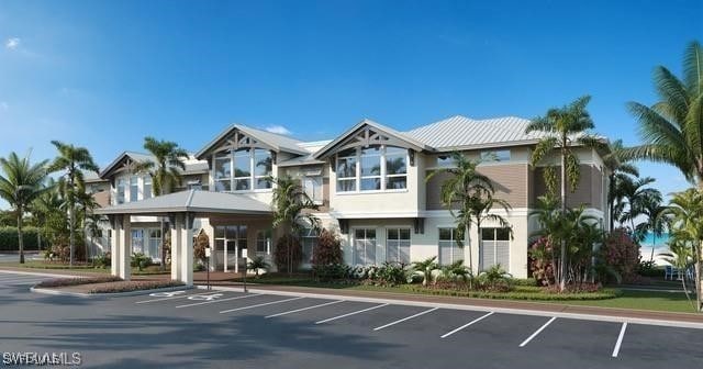26271 Devonshire Ct Unit 202, Bonita Springs, FL 34134 - view of building exterior featuring uncovered parking