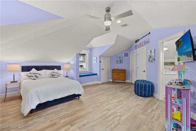 15411 Catalpa Cove Ln, Fort Myers, FL 33908 - bedroom with vaulted ceiling, ceiling fan, visible vents, and wood finished floors