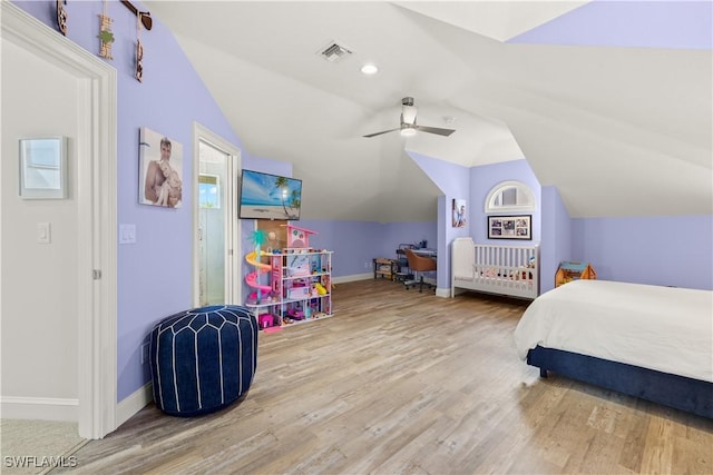 15411 Catalpa Cove Ln, Fort Myers, FL 33908 - bedroom featuring baseboards, vaulted ceiling, wood finished floors, and visible vents