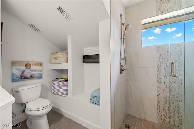 15411 Catalpa Cove Ln, Fort Myers, FL 33908 - bathroom with toilet, a shower stall, visible vents, and tile patterned floors