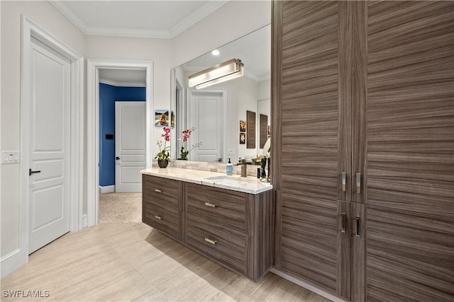 15411 Catalpa Cove Ln, Fort Myers, FL 33908 - bathroom with baseboards, ornamental molding, and vanity