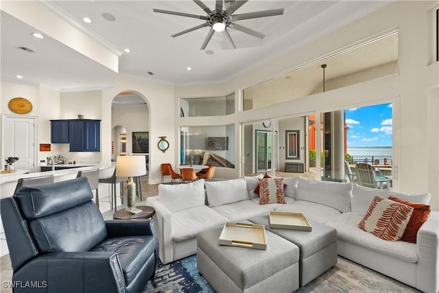 15411 Catalpa Cove Ln, Fort Myers, FL 33908 - living area featuring recessed lighting, ceiling fan, visible vents, crown molding, and arched walkways