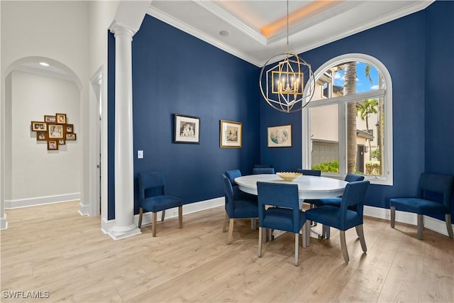 15411 Catalpa Cove Ln, Fort Myers, FL 33908 - dining space featuring crown molding, a notable chandelier, baseboards, and light wood finished floors