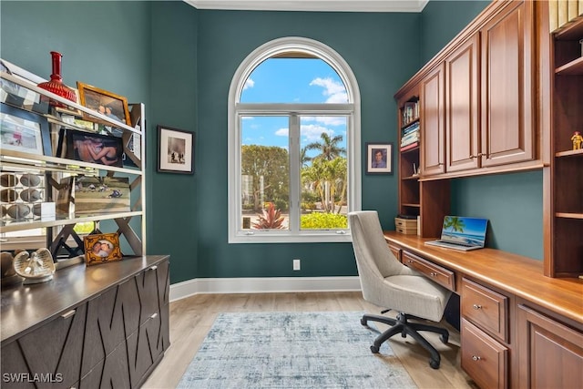 15411 Catalpa Cove Ln, Fort Myers, FL 33908 - office featuring built in study area, baseboards, and light wood-type flooring