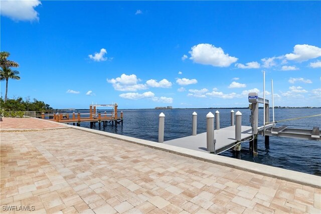 15411 Catalpa Cove Ln, Fort Myers, FL 33908 - view of dock with boat lift and a water view