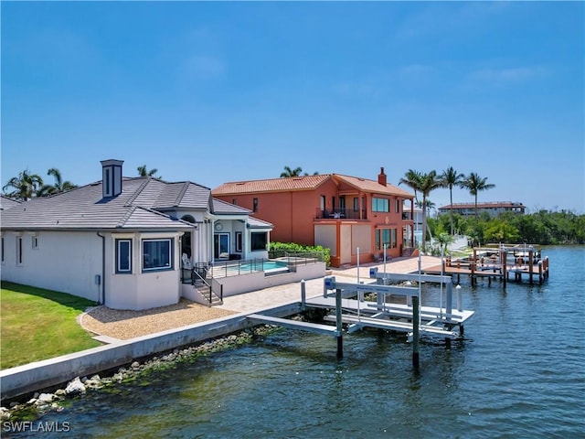 15411 Catalpa Cove Ln, Fort Myers, FL 33908 - view of dock with a balcony, a patio, an outdoor pool, a water view, and boat lift