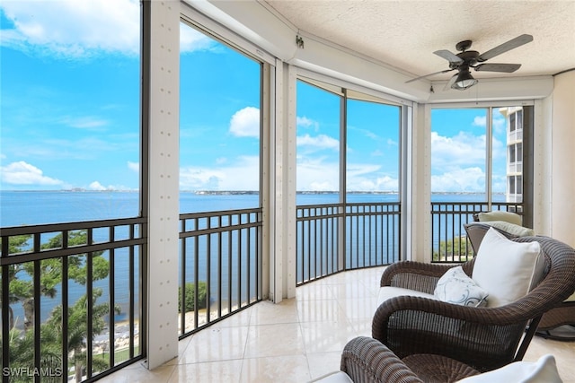 14220 Royal Harbour Ct Unit 607, Fort Myers, FL 33908 - sunroom featuring a water view, tile patterned floors, and a textured ceiling