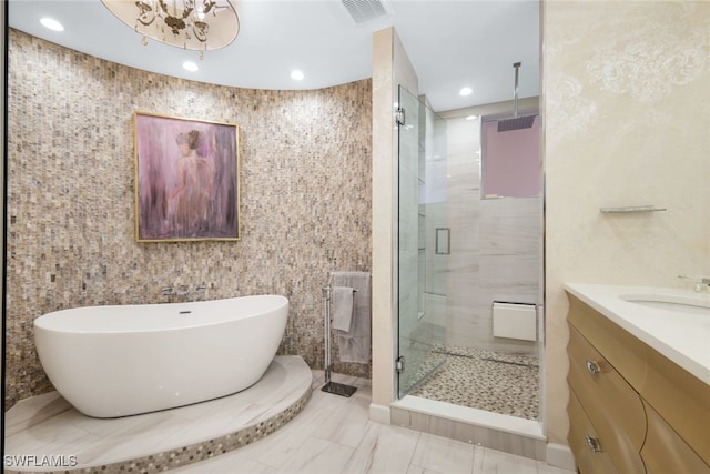 14220 Royal Harbour Ct Unit 607, Fort Myers, FL 33908 - bathroom with a shower stall, a freestanding tub, vanity, and recessed lighting