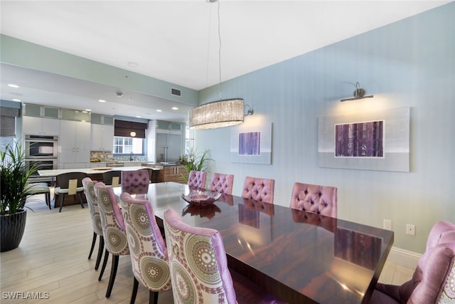 14220 Royal Harbour Ct Unit 607, Fort Myers, FL 33908 - dining area with light wood-style flooring and recessed lighting