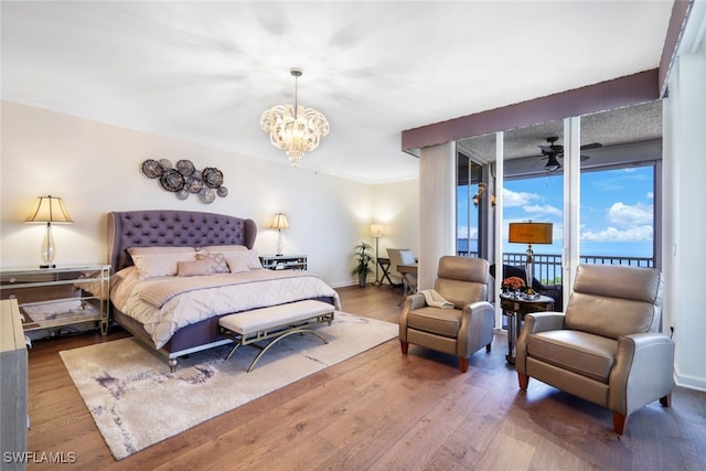 14220 Royal Harbour Ct Unit 607, Fort Myers, FL 33908 - bedroom featuring access to exterior, wood finished floors, a chandelier, and ornamental molding