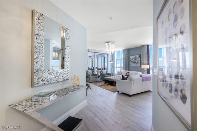 14220 Royal Harbour Ct Unit 607, Fort Myers, FL 33908 - living area with wood finished floors and a chandelier