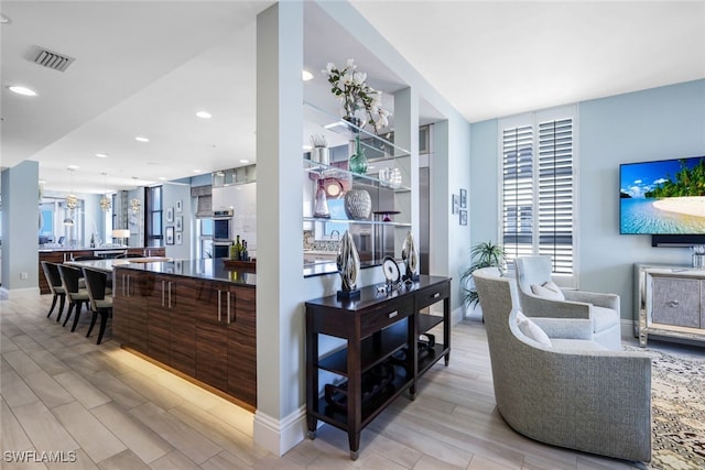 14220 Royal Harbour Ct Unit 607, Fort Myers, FL 33908 - living area featuring wood finished floors and recessed lighting