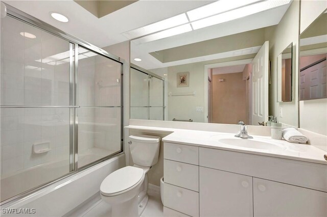 10910 Santa Margherita Rd Unit 101, Estero, FL 34135 - full bath with toilet, vanity, and enclosed tub / shower combo