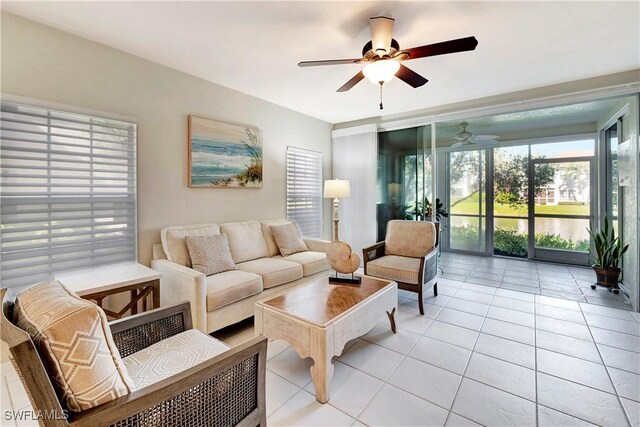 10910 Santa Margherita Rd Unit 101, Estero, FL 34135 - living room featuring a ceiling fan and light tile patterned flooring