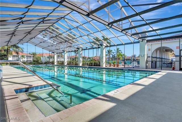 10910 Santa Margherita Rd Unit 101, Estero, FL 34135 - community pool with a patio area and exterior kitchen