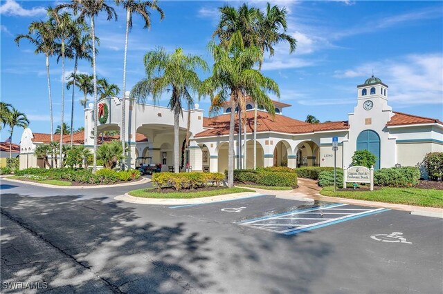 10910 Santa Margherita Rd Unit 101, Estero, FL 34135 - view of property with uncovered parking