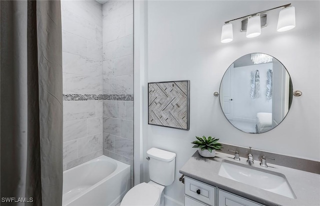 bathroom with toilet, vanity, and shower / bath combo