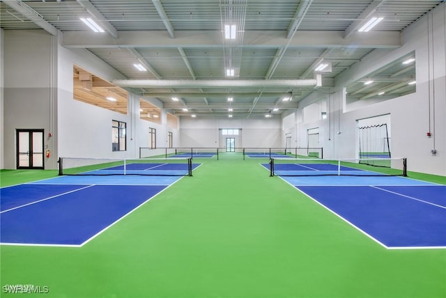 view of tennis court featuring fence