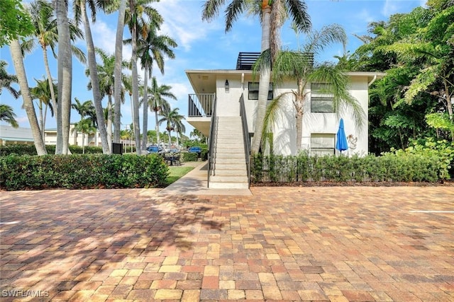 655 8th Ave S Unit 6, Naples, FL 34102 - view of front of home with stairway and stucco siding