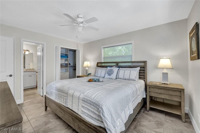 655 8th Ave S Unit 6, Naples, FL 34102 - bedroom with baseboards, a closet, light tile patterned floors, ensuite bathroom, and a ceiling fan
