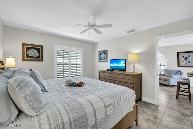 655 8th Ave S Unit 6, Naples, FL 34102 - bedroom featuring multiple windows, light tile patterned flooring, ceiling fan, and baseboards