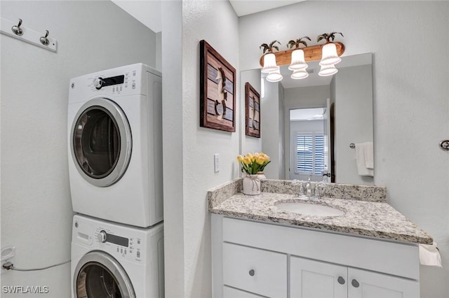 655 8th Ave S Unit 6, Naples, FL 34102 - clothes washing area with stacked washer / dryer