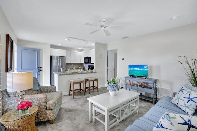 655 8th Ave S Unit 6, Naples, FL 34102 - living room with a ceiling fan