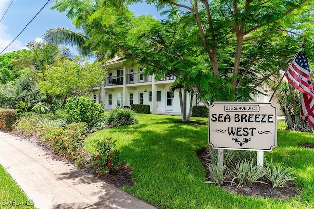 235 Seaview Ct Unit C4, Marco Island, FL 34145 - view of front of home featuring a front lawn, a balcony, and stucco siding