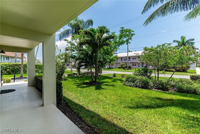 235 Seaview Ct Unit C4, Marco Island, FL 34145 - view of green lawn with a porch