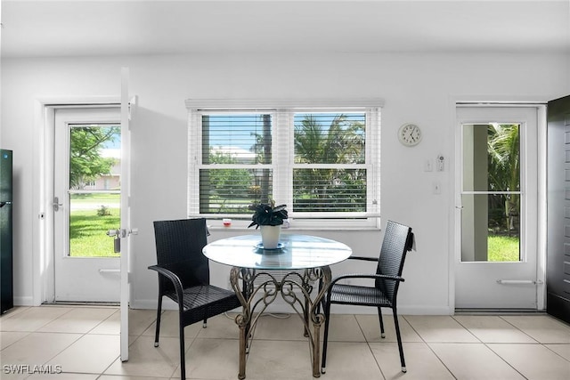 235 Seaview Ct Unit C4, Marco Island, FL 34145 - dining room featuring plenty of natural light and light tile patterned flooring