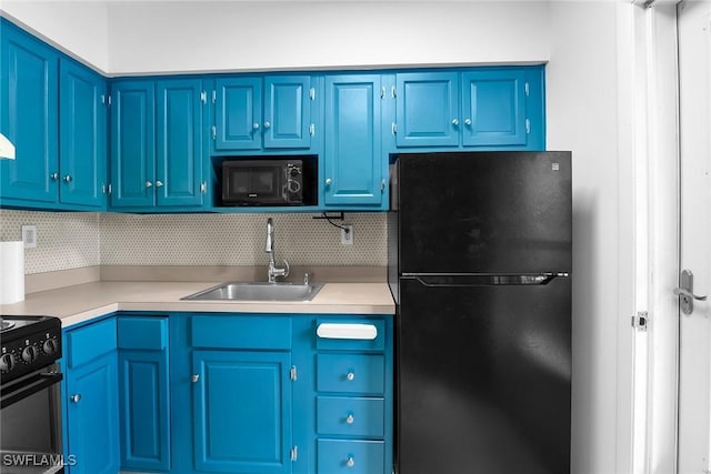 235 Seaview Ct Unit C4, Marco Island, FL 34145 - kitchen featuring black appliances, tasteful backsplash, light countertops, and blue cabinets