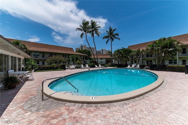 235 Seaview Ct Unit C4, Marco Island, FL 34145 - community pool featuring a patio area