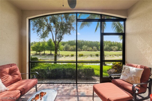 17960 Bonita National Blvd Unit 1716, Bonita Springs, FL 34135 - sunroom / solarium featuring view of golf course, plenty of natural light, and view of scattered trees
