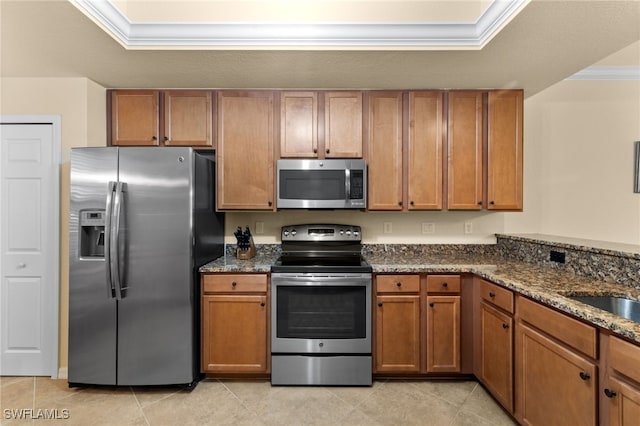 17960 Bonita National Blvd Unit 1716, Bonita Springs, FL 34135 - kitchen featuring stainless steel appliances, brown cabinetry, dark stone countertops, and ornamental molding