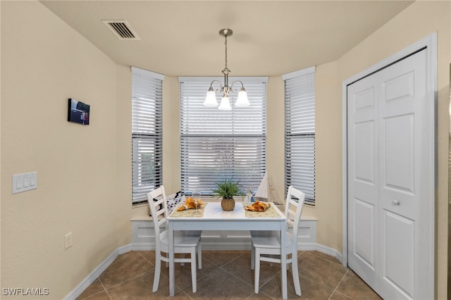 17960 Bonita National Blvd Unit 1716, Bonita Springs, FL 34135 - dining area featuring a chandelier, tile patterned floors, and baseboards