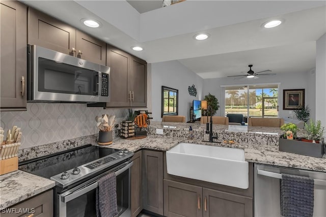 350 Newport Dr Unit 1902, Naples, FL 34114 - kitchen featuring appliances with stainless steel finishes, a sink, recessed lighting, a ceiling fan, and backsplash