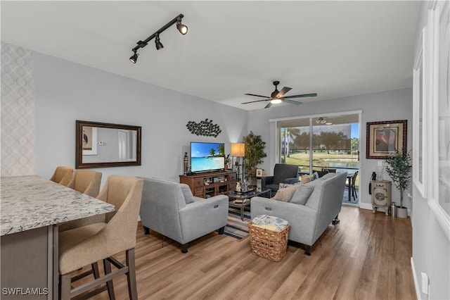 350 Newport Dr Unit 1902, Naples, FL 34114 - living area featuring light wood-style flooring, ceiling fan, and track lighting