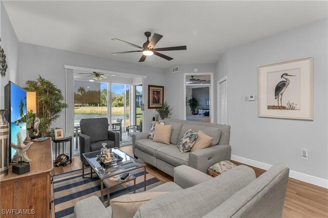 350 Newport Dr Unit 1902, Naples, FL 34114 - living area featuring a ceiling fan, wood finished floors, and baseboards