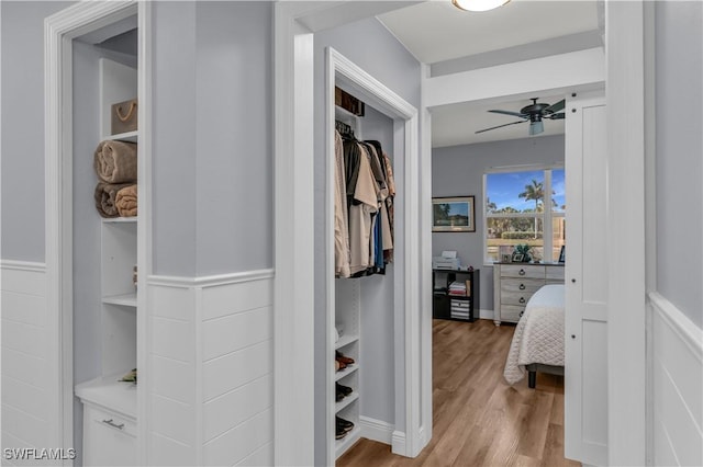 350 Newport Dr Unit 1902, Naples, FL 34114 - walk in closet featuring light wood-style floors and a ceiling fan