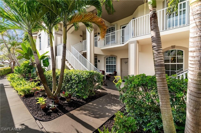 350 Newport Dr Unit 1902, Naples, FL 34114 - doorway to property with stucco siding