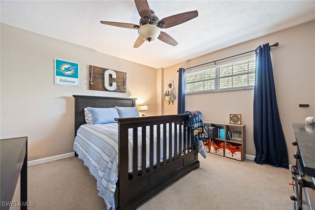217 W Del Monte Ave, Clewiston, FL 33440 - bedroom featuring a ceiling fan, baseboards, and carpet