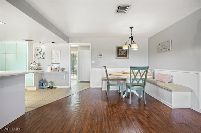 217 W Del Monte Ave, Clewiston, FL 33440 - dining room featuring a wainscoted wall, visible vents, and wood finished floors
