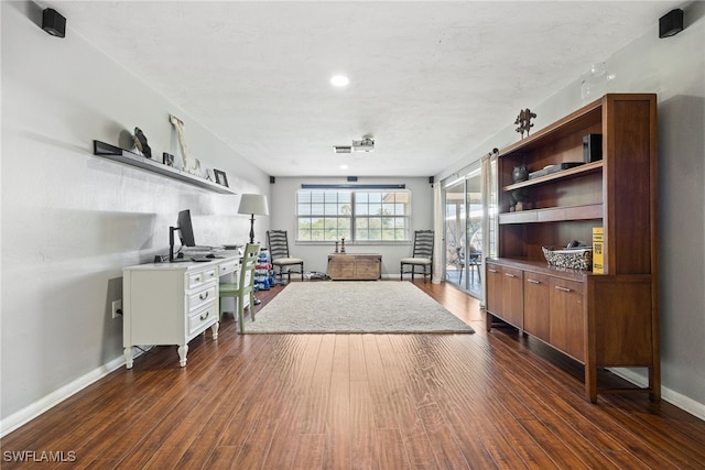 217 W Del Monte Ave, Clewiston, FL 33440 - living area with dark wood-style flooring and baseboards