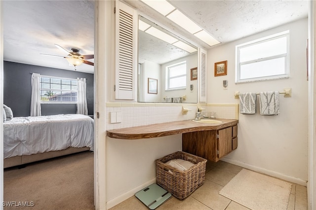 217 W Del Monte Ave, Clewiston, FL 33440 - bathroom featuring ensuite bathroom, tile patterned floors, vanity, and plenty of natural light