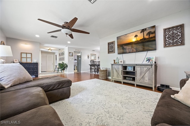 217 W Del Monte Ave, Clewiston, FL 33440 - living room with baseboards, a ceiling fan, visible vents, and wood finished floors