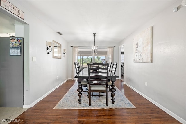 217 W Del Monte Ave, Clewiston, FL 33440 - dining room with baseboards, visible vents, and wood finished floors