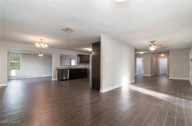 2414 Parkview Dr, Fort Myers, FL 33905 - unfurnished living room featuring a ceiling fan, dark wood finished floors, baseboards, a chandelier, and a textured ceiling