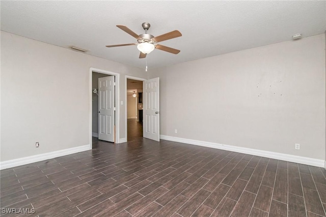 2414 Parkview Dr, Fort Myers, FL 33905 - unfurnished room with ceiling fan, baseboards, and dark wood-type flooring